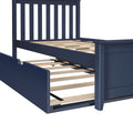 Navy blue wooden bed frame with slatted headboard and wooden slats, featuring a roll-out underbed storage trundle drawer