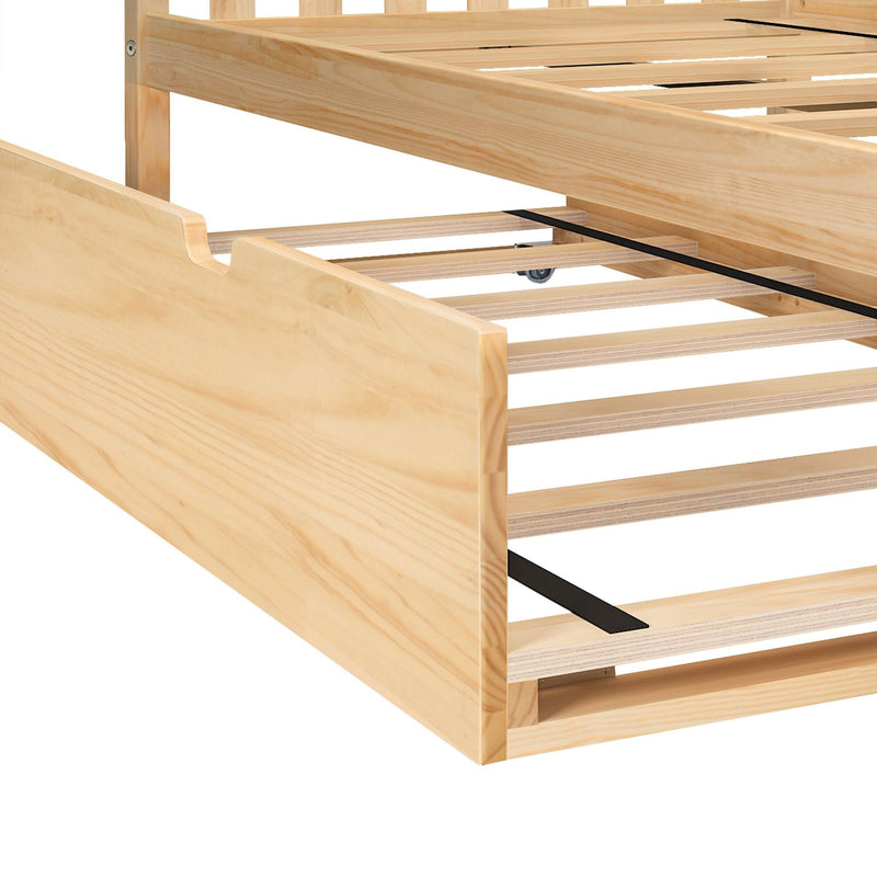 Close-up of a light pine wooden platform bed frame with slatted bed base, under-bed trundle rails with small caster wheel and black metal support straps in a natural wood finish