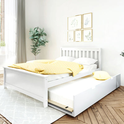 Bright minimalist bedroom featuring a white wooden trundle bed with pull-out mattress, yellow polka-dot duvet and pillow, botanical framed prints, potted green plant, and light herringbone wood floor