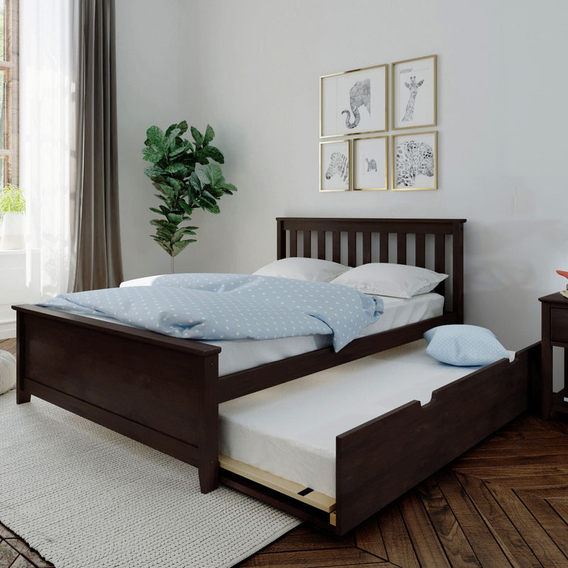Elegant bedroom with dark wooden bed frame and pull-out trundle against white walls, adorned with nature-themed art and a leafy green plant.