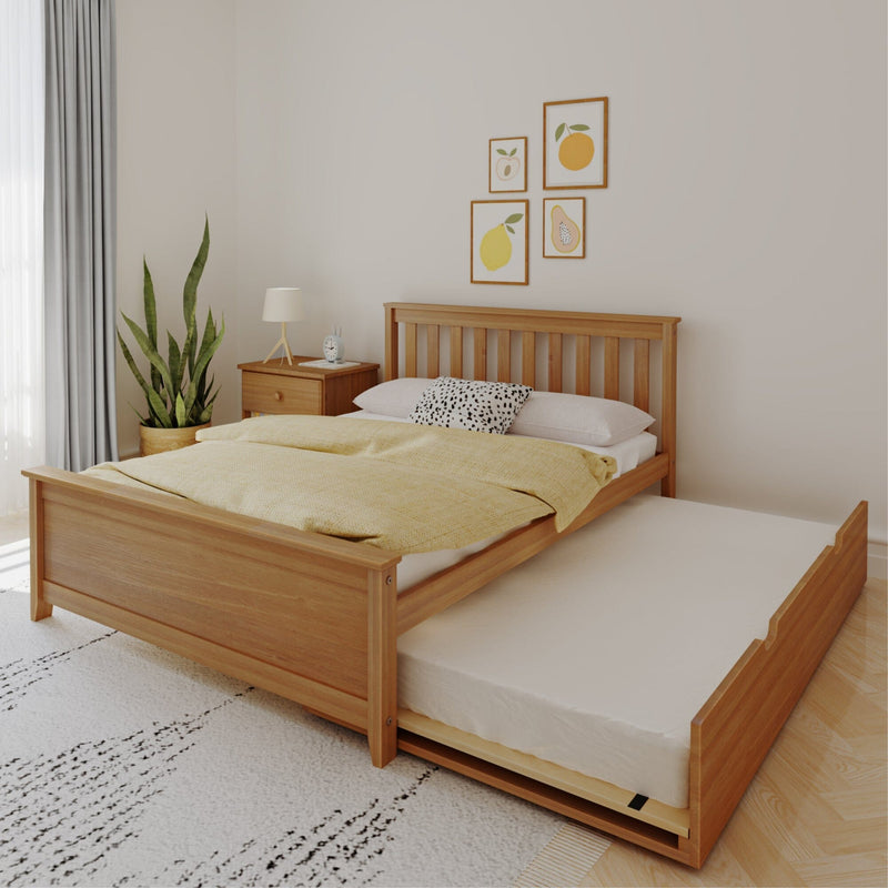 Minimalist Scandinavian bedroom with wooden platform bed and pull-out trundle, yellow duvet, patterned pillow, wooden nightstand, lamp, potted plant and framed fruit wall art
