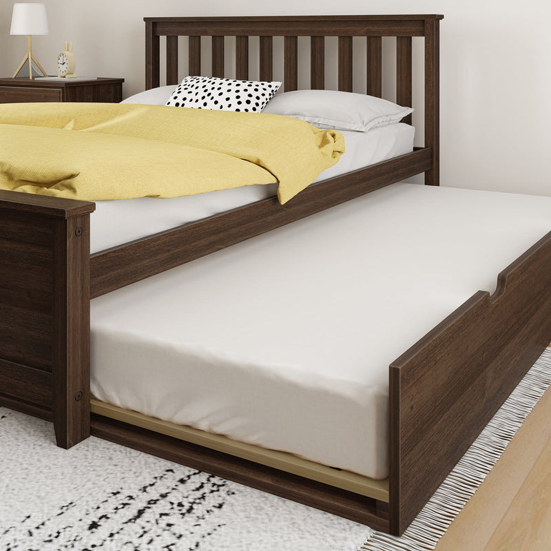 Wooden bed with pull-out trundle bed and yellow bedding set in modern bedroom.
