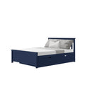 Navy blue wooden storage bed frame with built-in underbed drawers, gray textured linen bedding and white accent pillow on a platform headboard