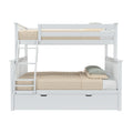 White wooden twin-over-full bunk bed with ladder and under-bed trundle drawer, beige quilted bedding and green gingham pillows, modern farmhouse kids’ bedroom furniture