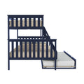Side view of navy blue wooden twin-over-twin bunk bed with ladder and pull-out trundle, beige bedding on white background