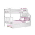 White wooden twin-over-full bunk bed with staircase and under-bed storage drawer, pink bedding — space-saving kids bedroom furniture