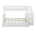 White wooden twin-over-full bunk bed with built-in staircase and under-bed storage drawer, slatted mattress supports, isolated on white background
