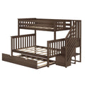 Dark brown wooden loft bunk bed with built-in staircase, slatted guardrails, wooden slat mattress supports and pull-out trundle drawer — space-saving children's bedroom furniture