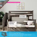 Modern dark-gray wooden kids bunk bed with staircase and built-in under-bed storage drawer, loft-style top bunk with safety rails and lower daybed with pillows and framed animal wall art in a children's bedroom