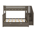 Gray wood loft bed frame with built-in staircase, slatted mattress platform, safety guardrails and under-bed storage drawer — space-saving kids' bunk bed