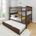 Dark walnut wooden bunk bed with ladder and pull-out trundle, gray knit bedding and yellow accent pillows in a bright modern kids' bedroom by a large window