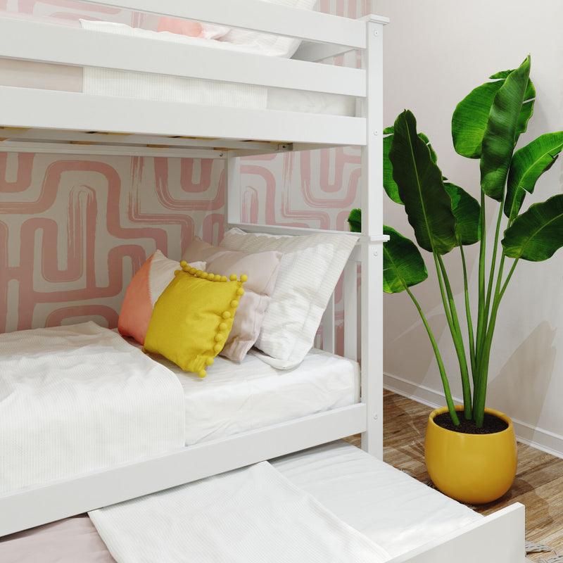 White bunk bed in a modern bedroom with geometric wallpaper, colorful pillows, and a large potted plant for vibrant interior decor.