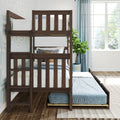 Solid dark wood bunk bed with pull-out trundle in bright modern kids' bedroom with blue curtains and potted plant