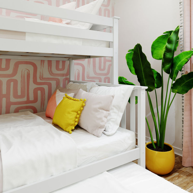 White bunk bed with colorful pillows, vibrant plant, and modern pink geometric wallpaper.