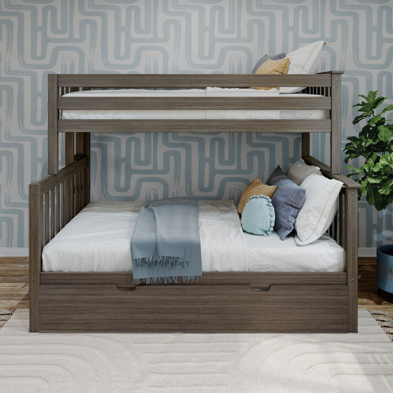 Gray wooden twin-over-full bunk bed with under-bed storage drawer, white bedding and blue throw pillows in a children's room with geometric wallpaper and potted plant