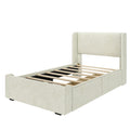 Beige upholstered platform bed frame with tall padded headboard, padded side rails and wooden slat mattress support