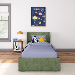 Children's bedroom with green bed frame, space-themed wall art, and playful pillows.
