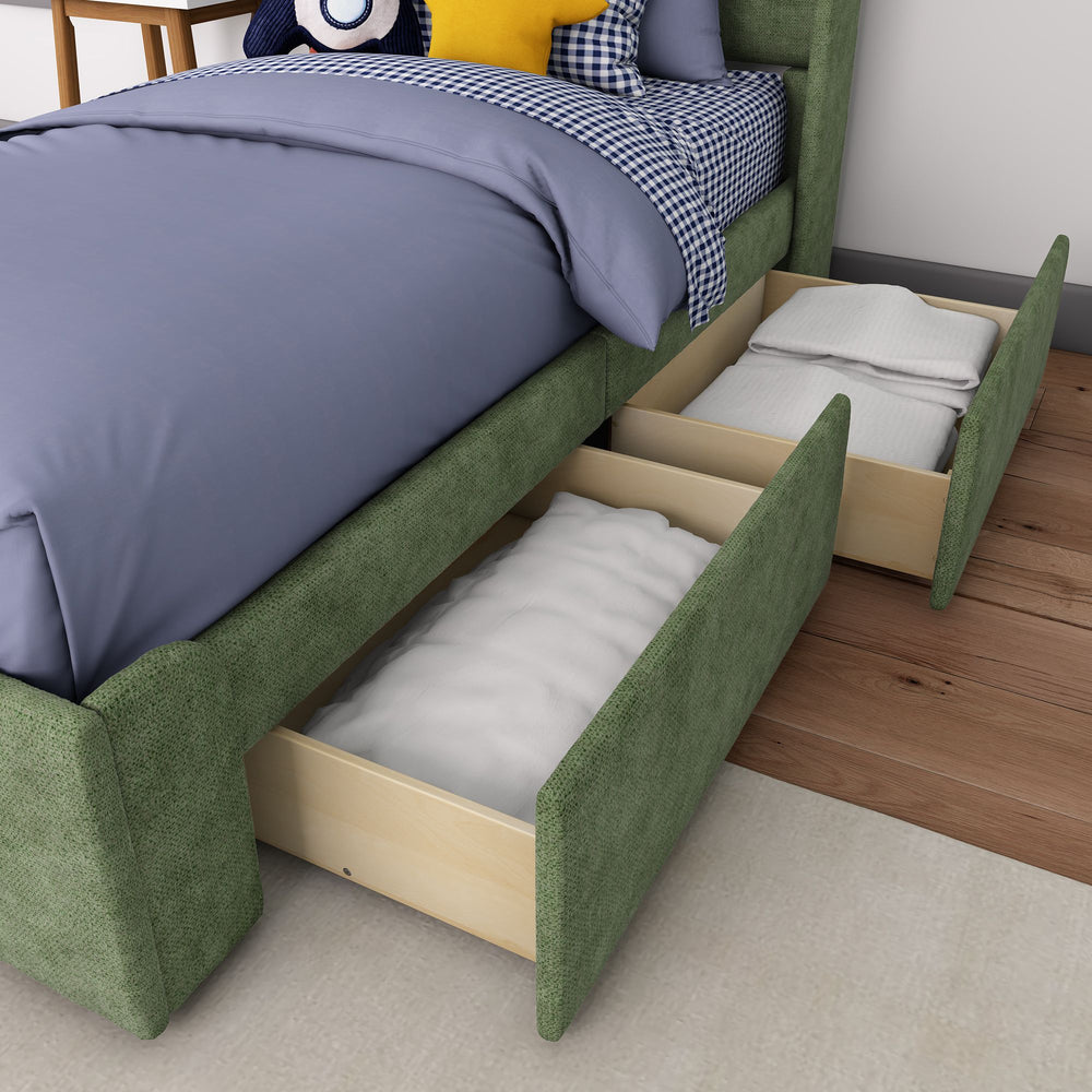 Green upholstered bed with open under-bed storage drawers on wooden floor.