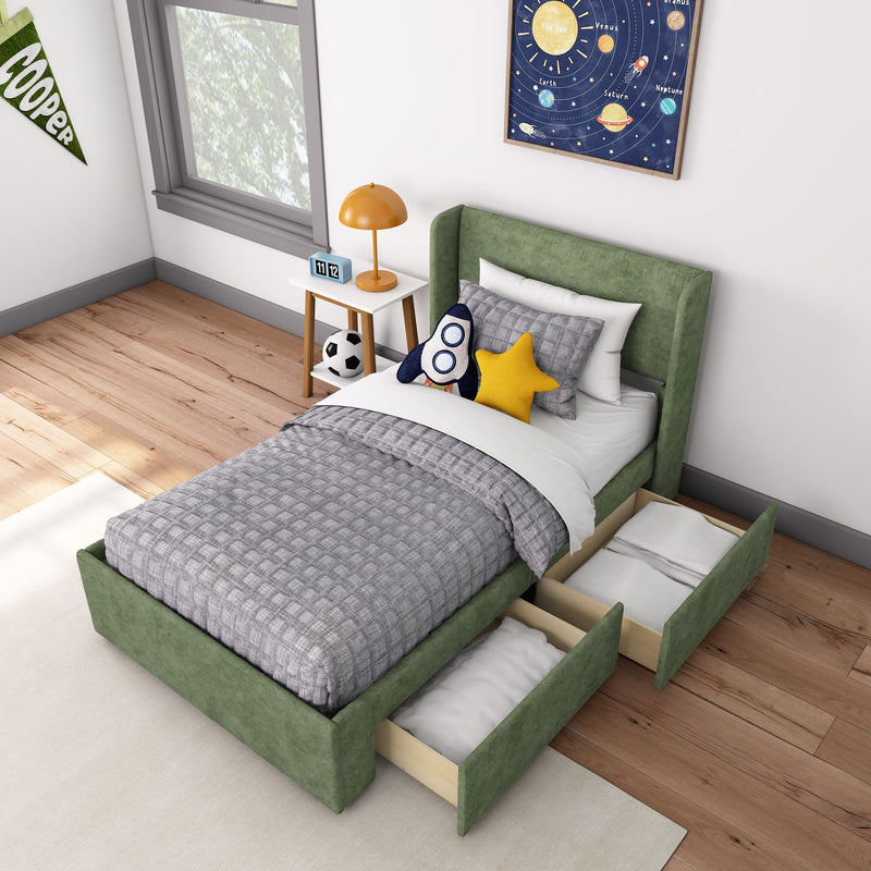 Kids bedroom with green upholstered storage bed and pull-out drawers, gray quilt, rocket plush and star pillow, space poster, orange bedside lamp and soccer ball