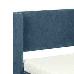 Blue upholstered bed frame with modern headboard design.