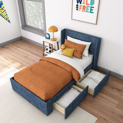 Cozy kids' bedroom with orange bedding and blue upholstered bed frame featuring under-bed storage drawers.