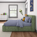 Modern kids bedroom with green upholstered bed, blue gingham bedding, owl pillow, rocket toy, space poster and "Cooper" pennant by window and dresser