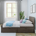 Cozy modern bedroom with wooden window, sheer gray curtains, pastel blue bedding, storage bed, potted plant and framed wall art