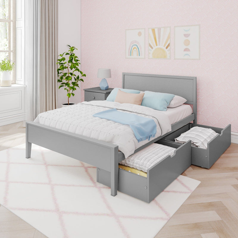 Modern bedroom with grey storage bed, pink patterned walls, decorative plants, and framed art on the wall.