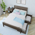 Modern bedroom: dark wood platform bed with trundle, white quilt and pastel pillows, nightstand with blue lamp, potted plant.