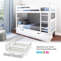 White wooden twin-over-twin bunk bed with ladder, pull-out storage drawers and blue-gray bedding in a bright kids' bedroom