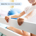 Close-up of a child gripping a white extra-tall 14-inch crib guardrail, highlighting nursery safety bed rails and toddler bedside protection