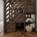 Dark wood staircase with built-in under-stair storage and children's play nook featuring a rainbow stacker and wicker basket