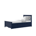 Navy blue wooden twin storage bed with slatted headboard and two under-bed drawers, styled with white mattress and gray pillows
