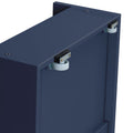 Close-up of navy blue cabinet back showing white roller glides and metal mounting brackets for wall-mounted storage furniture