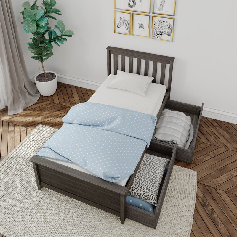 Gray wood twin bed with under-bed storage drawers and blue polka-dot bedding in modern minimalist bedroom with potted fiddle-leaf fig and hardwood parquet floor