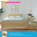 Solid New Zealand pine bed frame with headboard and under-bed trundle drawer in styled bedroom with blue polka-dot duvet, matching nightstand and pendant light — product feature image