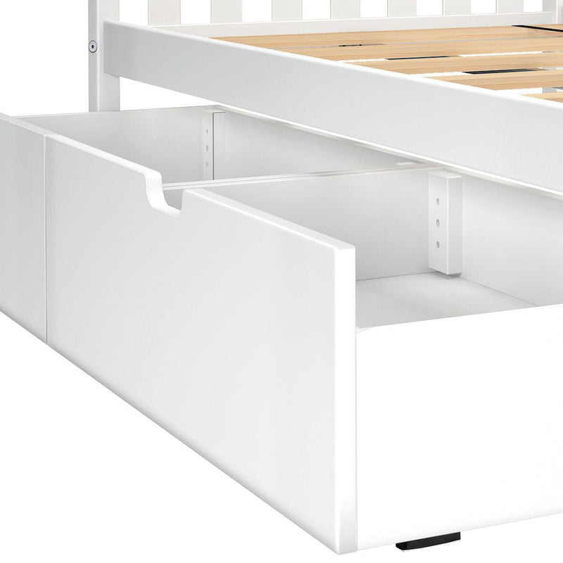 White pull-out underbed storage drawer integrated into white wooden bed frame with slatted wood mattress support — space-saving bedroom storage solution