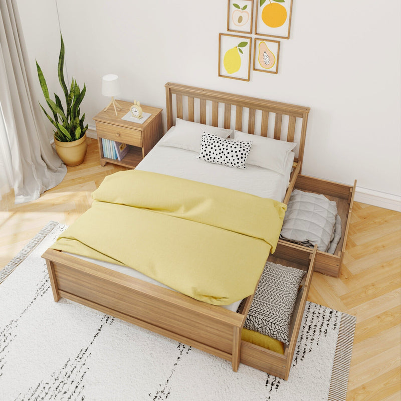 Cozy bedroom with wooden bed frame featuring storage drawers, yellow bedding, a nightstand, potted plant, and decorative fruit wall art.