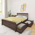 Dark wood platform bed with pull-out under-bed storage drawers, yellow duvet, polka-dot pillow and framed fruit prints in bright modern bedroom