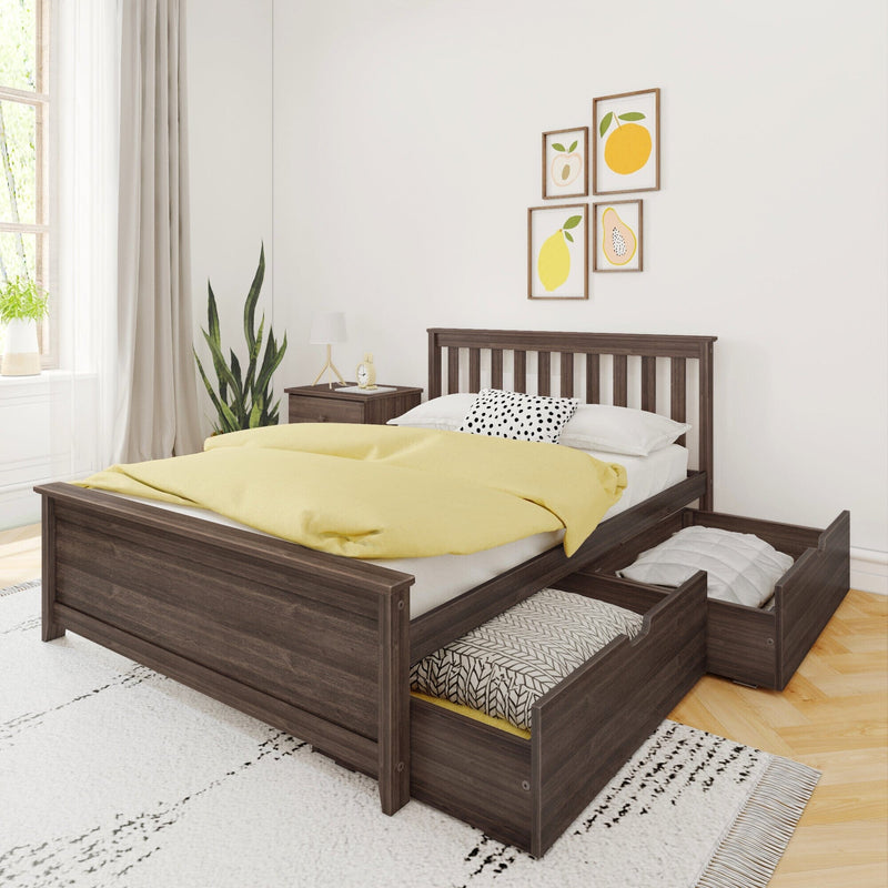Dark wood platform bed with pull-out under-bed storage drawers, yellow duvet, polka-dot pillow and framed fruit prints in bright modern bedroom