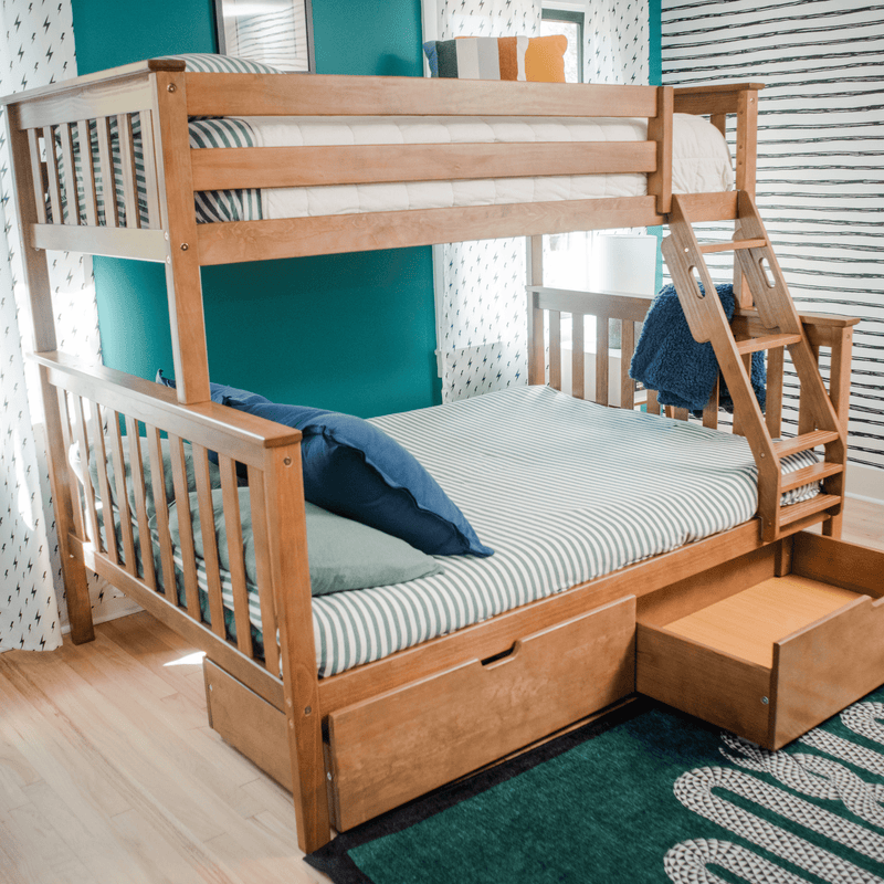 Wooden bunk bed with a striped bedspread in a modern bedroom setting, featuring teal and white walls and storage drawers.