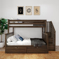 Modern dark wood bunk bed with built-in storage drawers, white bedding and patterned throw, staircase, three framed minimalist prints, potted plant and woven rug in a stylish children's bedroom decor