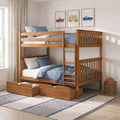 Solid wood bunk bed with underbed storage drawers and blue bedding in a children's bedroom with framed car wall art