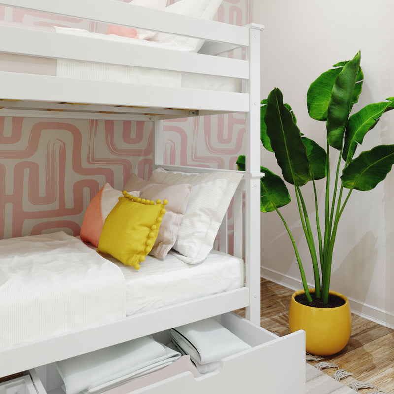 Modern bunk bed setup with white linens, colorful pillows, and a tall green plant in a yellow pot, complemented by a geometric pink wallpaper.