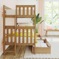 Wooden bunk bed with pull-out trundle drawers in bright children's bedroom with pink geometric wallpaper, yellow bedding, houseplant and sunny window seat
