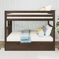 Dark walnut twin-over-twin bunk bed with under-bed storage drawers, white bedding, blue throw and decorative pillows in modern kids' bedroom