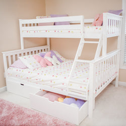 White children's bunk bed with colorful bedding and storage drawers in a cozy bedroom.