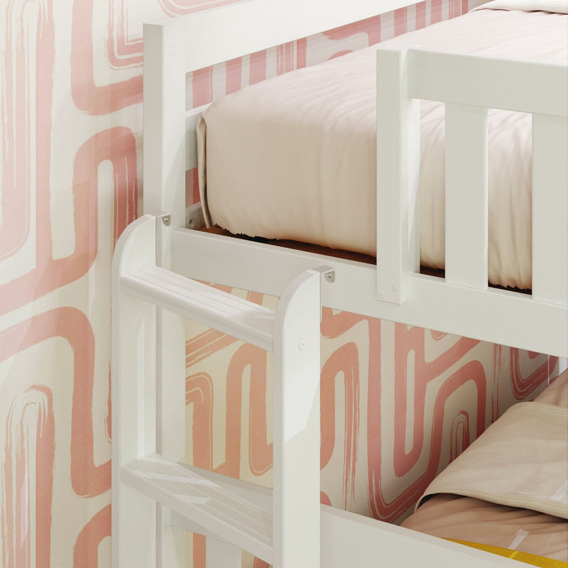 White wooden bunk bed ladder and safety guardrail against blush pink retro wallpaper with beige bedding — modern space-saving kids' bedroom design