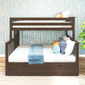 Dark wood twin-over-twin bunk bed with under-bed storage drawers, white and blue bedding, decorative pillows and blue geometric wallpaper in kids' bedroom