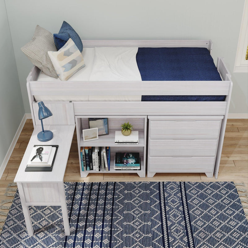 White wood loft bed with built-in desk, drawers and bookshelf, navy bedding and decorative pillows on a blue patterned rug — modern kids' and teen bedroom storage and workspace